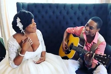 Niecy Nash's wife Jessica playing the guitar for her.